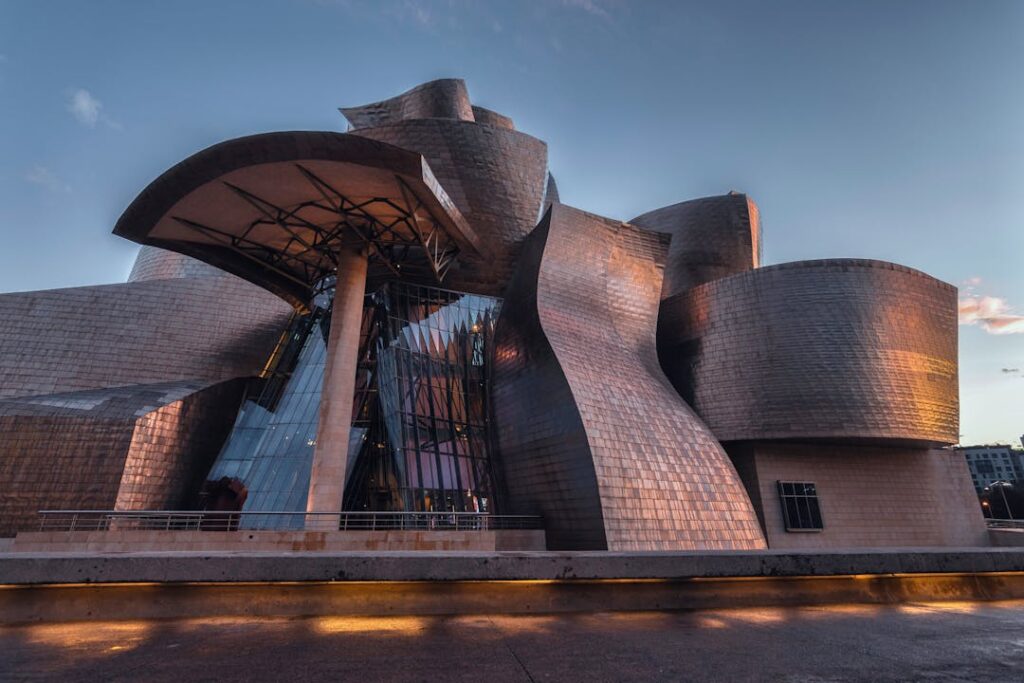Stunning view of the Guggenheim Museum Bilbao's modern architecture at sunset.