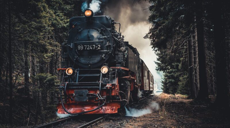 A vintage steam train travels through a dense forest under dramatic skies, exuding nostalgia and adventure.