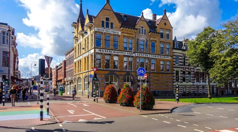 Street view of a historic building in central Haarlem, Netherlands under a blue sky.
